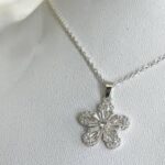 CADENA ACERO DORADO C/DIJE FLOR BZCADI327P GAO